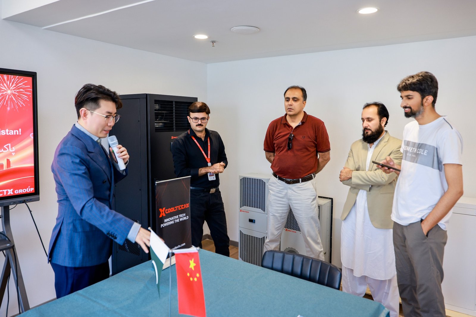 Cooltechx team discussing data center cooling products with Pakistani government officials